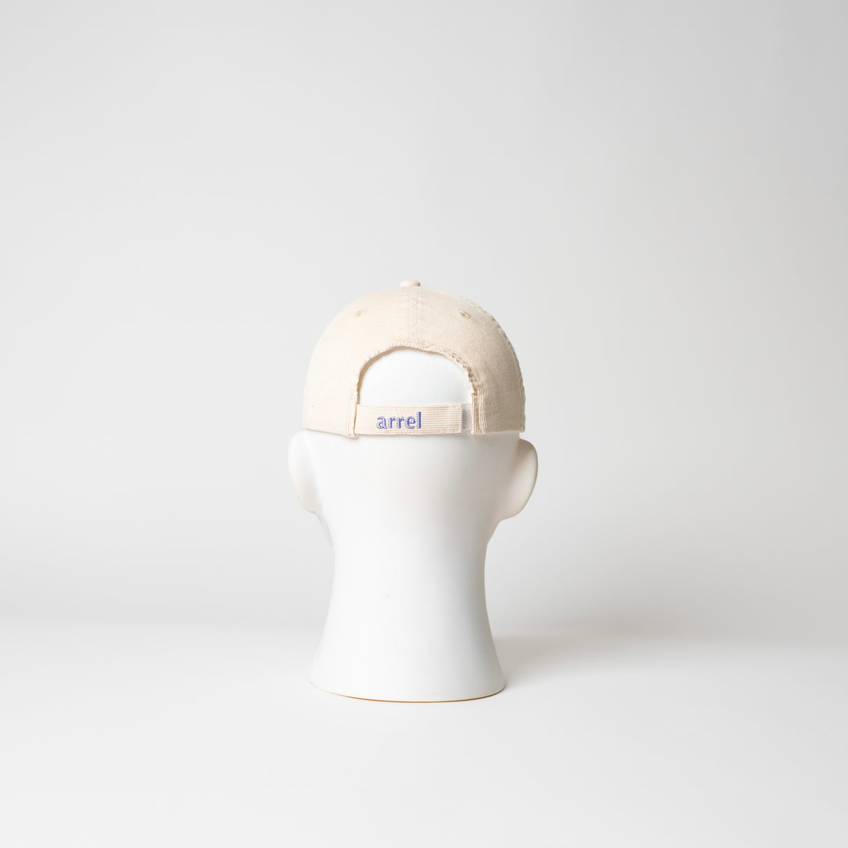 arrel Kappe “Don’t Be a Racist” Beige/Lavendel | Klare Botschaft | arrel