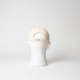 arrel Kappe “Don’t Be a Racist” Beige/Lavendel | Klare Botschaft | arrel